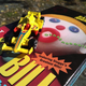 Illustration for article titled Just some bored dude taking pics of crappy diecasts at a boring yard sale...